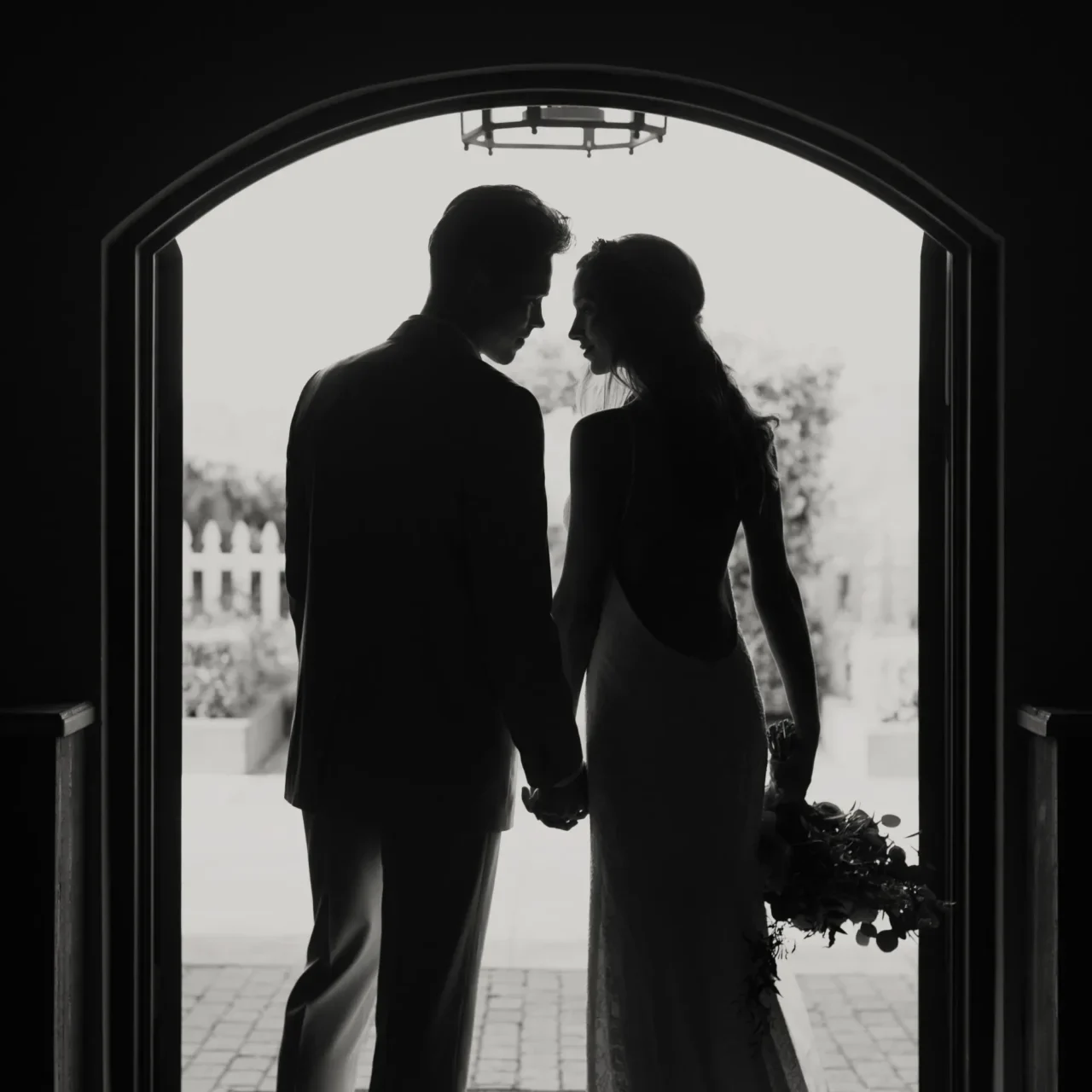 Elegant couple framed by architectural detail at a Washington wedding.